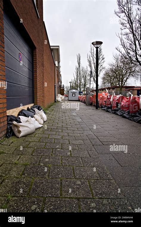 Sandbags For Garage And House Doors On Sidewalk To Prevent Flooding And