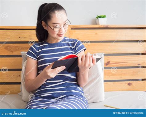 Woman is Reading Book on the Bed. Stock Photo - Image of education ...