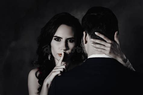 Portrait Of Tempting Brunette Lady Showing Silence Sign With Forefinger Touching Secret