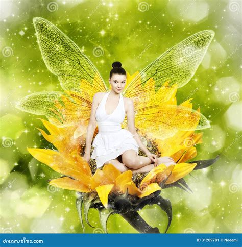 Beautiful Young Brunette Woman As Summer Fairy On Sunflower Stock Image