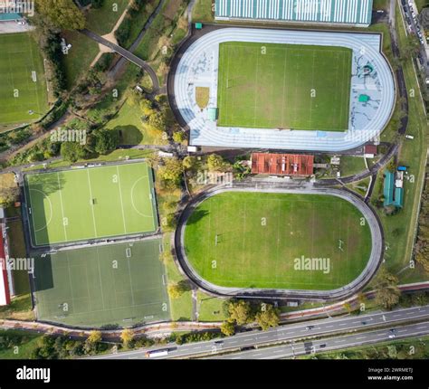 A Top Down Drone Photograph Showcasing Various Sports Fields Including A Running Track Football