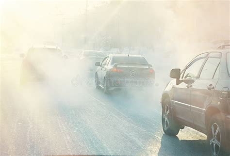 Air Pollution From Exhaust Fumes From Cars In The City On A Cold Day Air Pollution In Cities