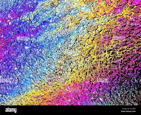 Oil slick rainbow on path Stock Photo - Alamy