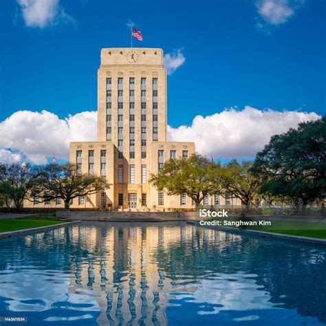 Houston City Hall Building Skyline Waving American Flags And Live Oak