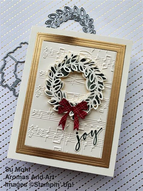 A Card With A Christmas Wreath On It