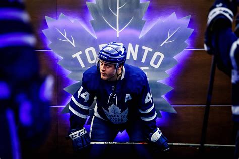 Download Toronto Maple Leafs Illuminating Logo Morgan Rielly Wallpaper