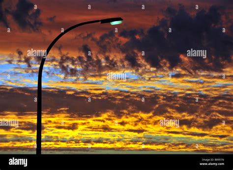 A Single Street Light At Sunset Stock Photo Alamy