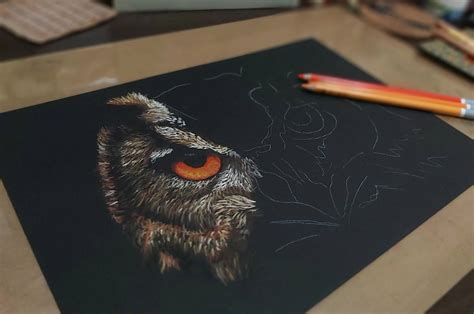 Drawing on black paper with pastel pencils, coloured pencils and other dry media