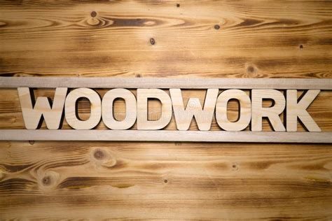 Woodwork Word Made With Building Blocks On Wooden Board Stock Photo