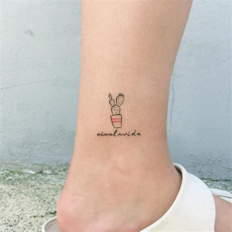 A Tiny Tattoo Of The Phrase ‘viva La Vida And A Cactus In A Pot Inked