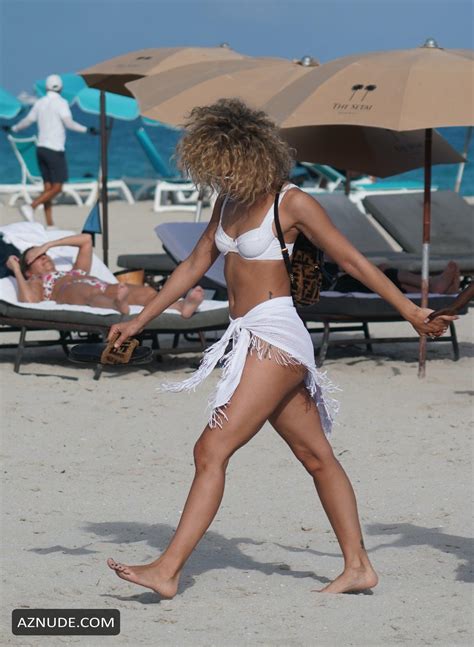 Jasmine Sanders Wears A White Bikini With A Matching Wrap At The Beach With Friends In Miami