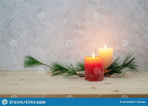 Two Candles Lit For The Second Advent Pine Branch As A Simple Minimal