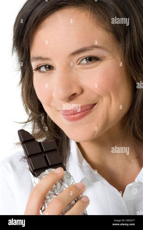 Close Up Of A Young Woman Eating Chocolate Stock Photo Alamy