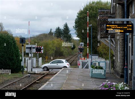 A Car Going Across The Level Crossing At Bucknell Station Heart Of