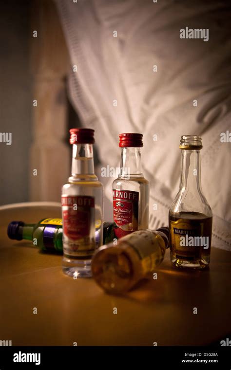 Miniature Bottles Of Alcoholic Drinks From Hotel Mini Bar On Bedside