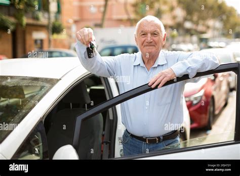 Old Man Standing Beside Car Stock Photo Alamy