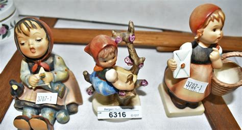 Bid Now Hummel Figurines Singing Lesson Seated Girl Knitting