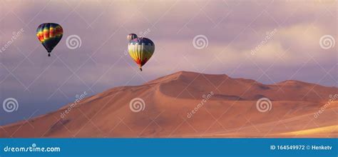 Three Colorful Hot Air Balloons Over The Sand Dunes In Namib Desert