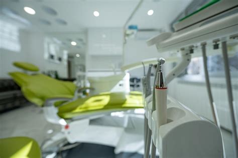 Premium Photo Detail Of A Dental Tools Attached To A Dental Chair In