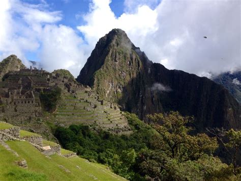 The Ruins Of Machaca Picach Are Surrounded By Trees And Mountains