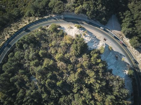 Aerial Photography of Cars on a Curve Road · Free Stock Photo