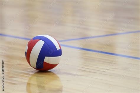 Red White And Blue Volleyball On An Indoor Wood Court Stock Photo