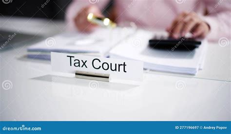 Tax Court Nameplate On Table With Judge Writing Stock Image Image Of