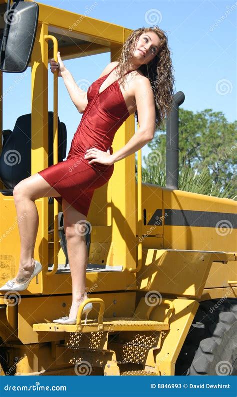 Woman In Red Dress On Bulldozer Stock Image Image Of Miniskirt Heels 8846993