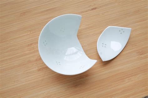 Pieces of Broken Ceramic Bowl on Wood Background Stock Photo - Image of destroy, accident: 130350838