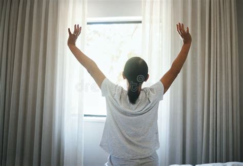 Stretching Curtains And Back Of Woman At Window For Wake Up Sunrise Or Good Morning Routine In