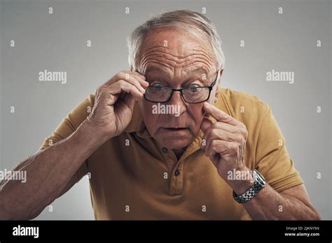 Im Definitely Getting Old Studio Shot Of An Elderly Man Adjusting His