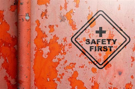 Premium Photo Text Of Safety First Sign On Grunge Red Wall Background