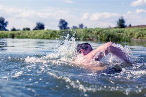 The Young Man Swimming in the River Stock Photo - Image of exercise, muscular: 147488296