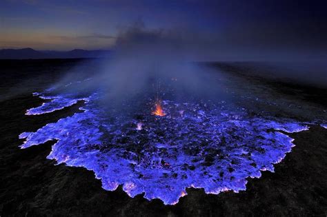 Blue Lava Erupting From The Kawah Ijen Volcano In Indonesia The