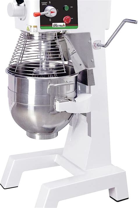 A White Mixer Sitting On Top Of A Stand