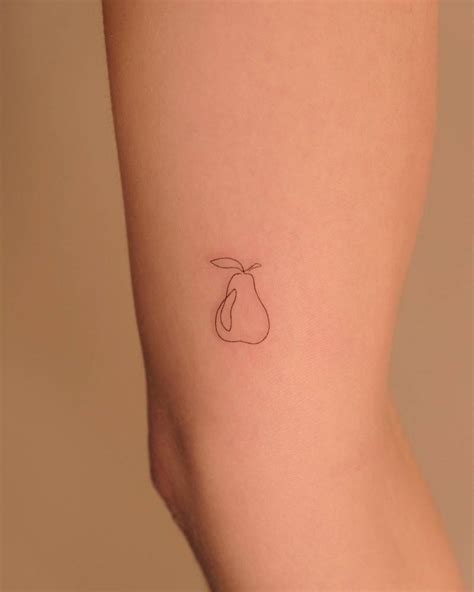 One Line Pear Tattoos On The Upper Arm