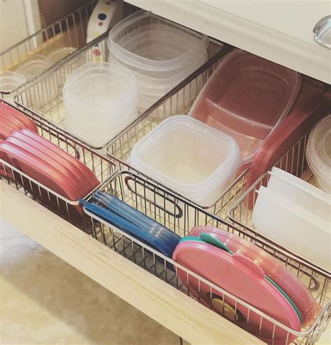 His Tupperware Drawer Got Organized With The Help Of Metal Wire Storage