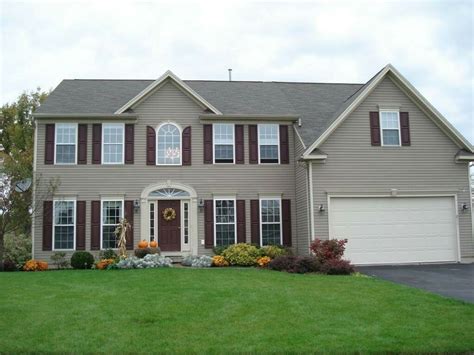 Tan Siding With Maroon Shutters Exterior House Colors House Paint