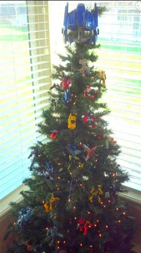 A Christmas Tree Decorated With Toys And Lights In The Shape Of Bums Cars