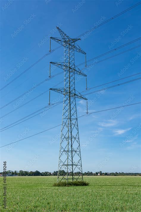 Overhead Power Line On The Field Electric Power Line Overhead Power Transmission Lines In