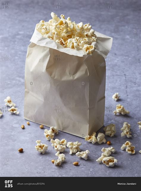 Paper bag of microwave popcorn stock photo - OFFSET