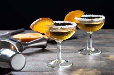 Premium Photo Sidecar Cocktail With A Sugar Rim On Wooden Table