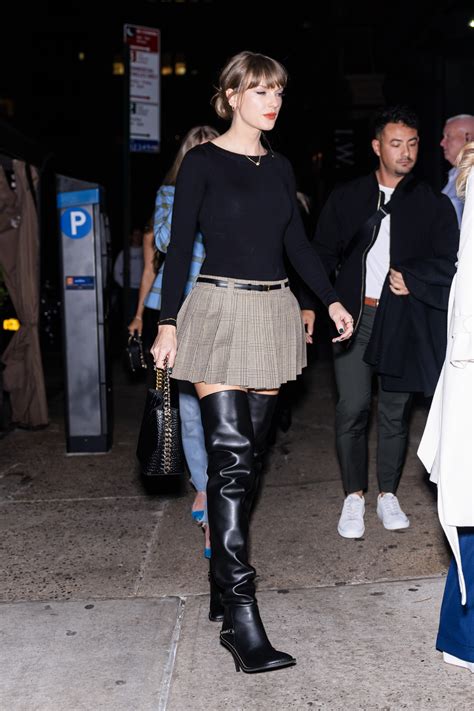 Taylor Swift Pairs Pleated Miniskirt With Sexy Thigh High Boots For