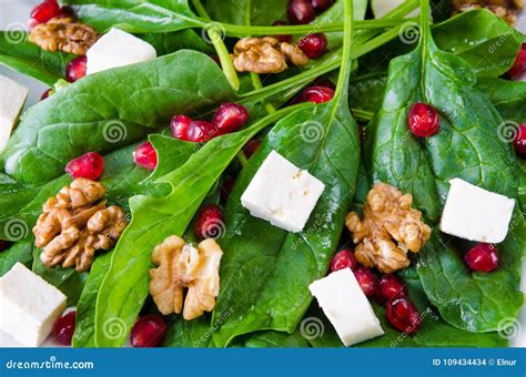 The Spinach Salad with Nuts and Apples Served on Table Stock Photo ...