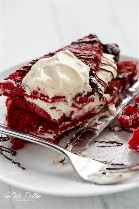 A Piece Of Red Velvet Cake With Whipped Cream On Top