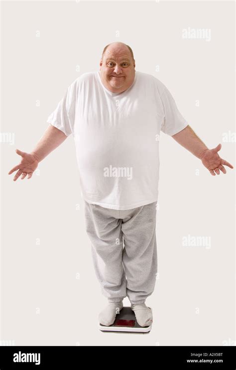 Full Body View Of Overweight Man Standing On A Scale Stock Photo Alamy