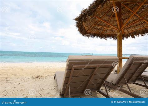 Sand Beach With Parasol And Sunbeds Stock Photo Image Of Relax