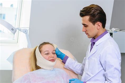 Plastic Surgery Doctor Patient Inspection And Consultation Stock Photo