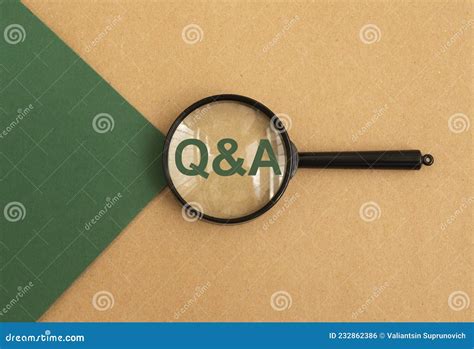 Qna Acronym Through Magnifying Glass On Green And Brown Paper Top View Concept Of Eco