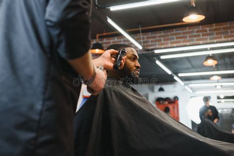 Visiting Barbershop. African American Man in a Stylish Barber Shop ...